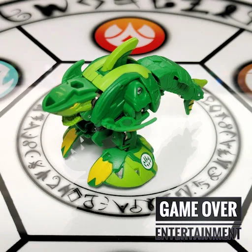 a green toy on a white surface